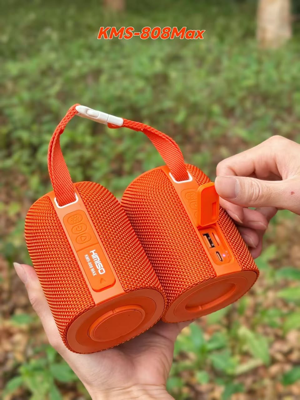 Kimiso KMS-808MAX Bluetooth speaker with box, shown in black, teal and orange